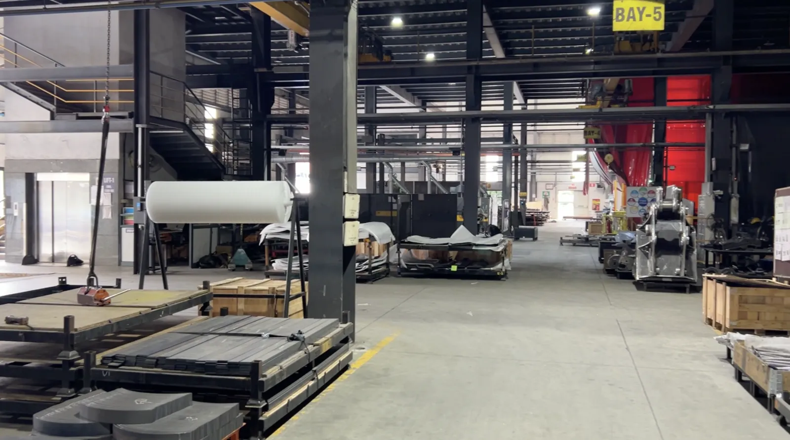 Heavy fabrication work bays and material handling areas inside a partner facility
