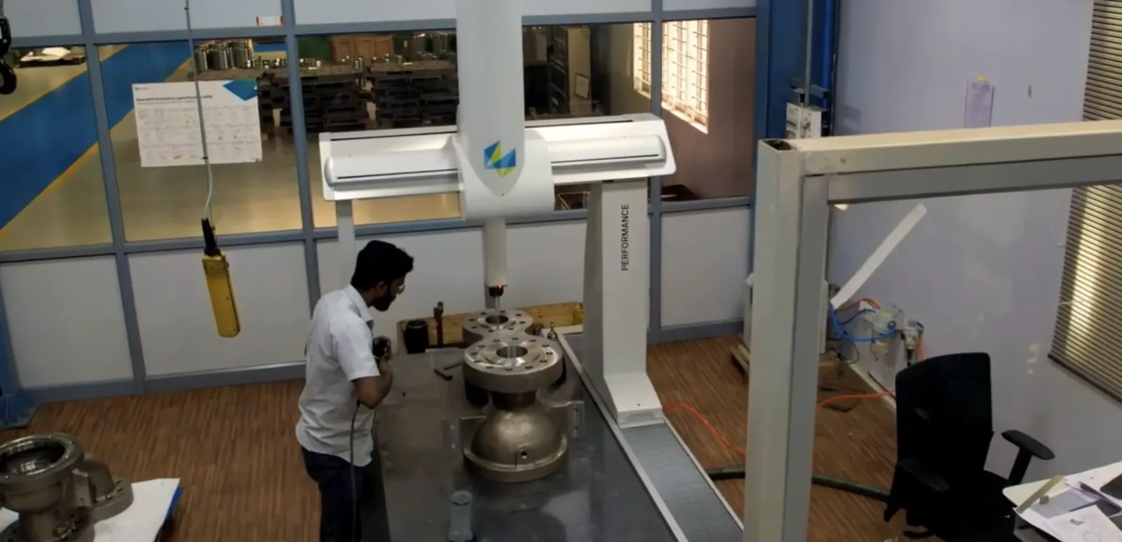 Coordinate measuring machine inspecting a manufactured component