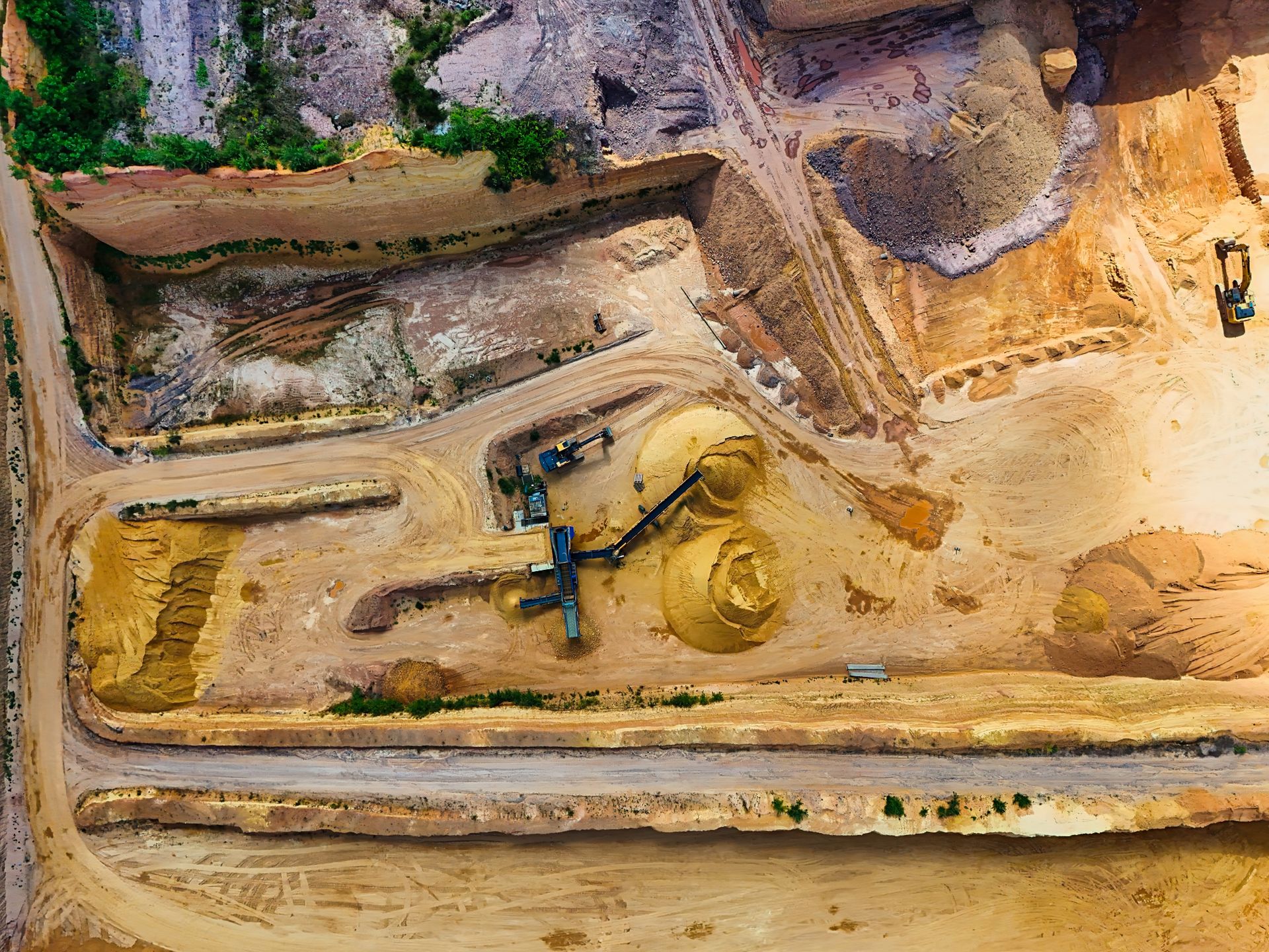 Heavy mining equipment operating at a large industrial site
